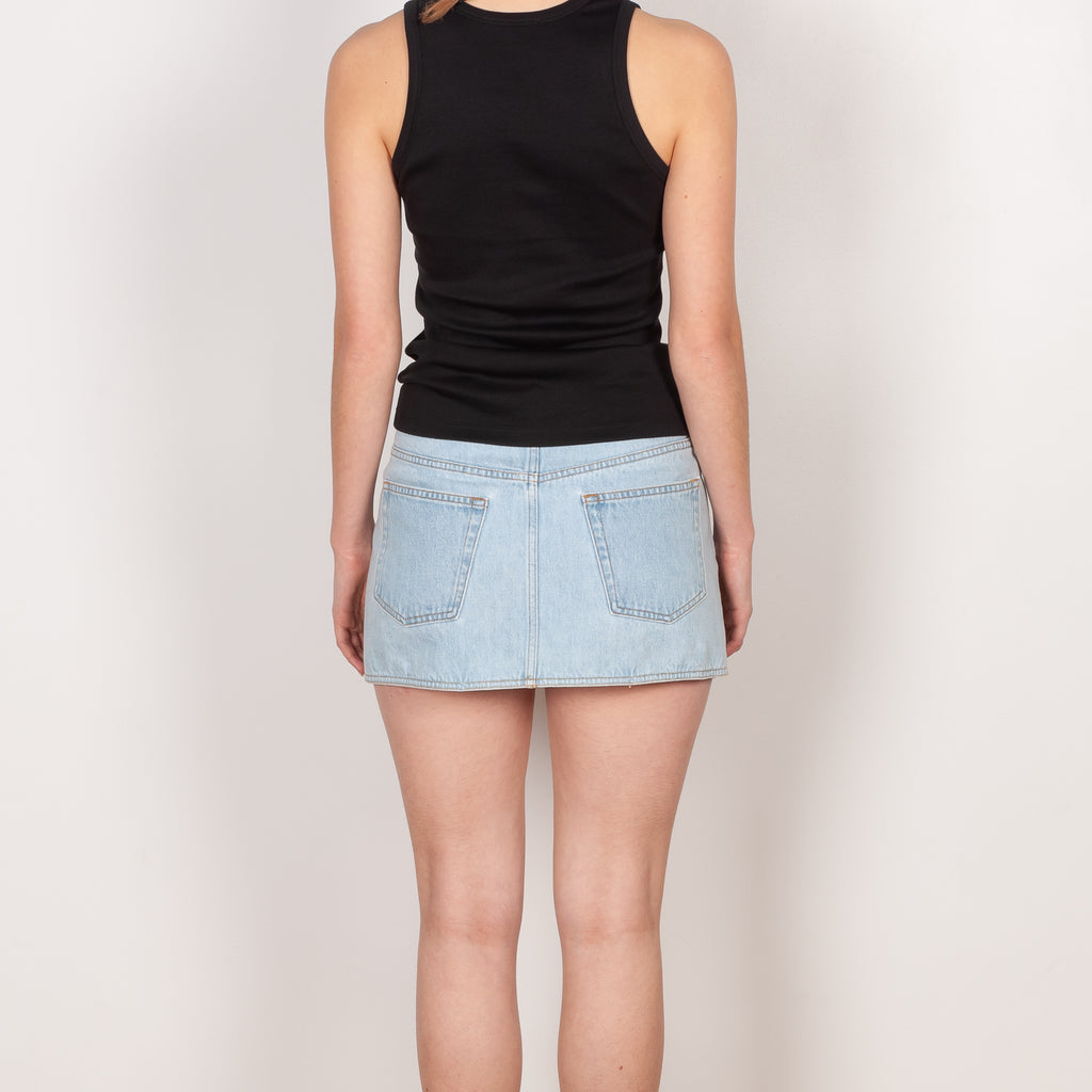 The Denim Mini Skirt by Coperni is a signature fold-over mini skirt in light blue denim