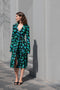 The Print Wrap Dress by Coperni is a feminine wrap dress with a Coperni Logo hardware detail