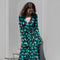 The Print Wrap Dress by Coperni is a feminine wrap dress with a Coperni Logo hardware detail