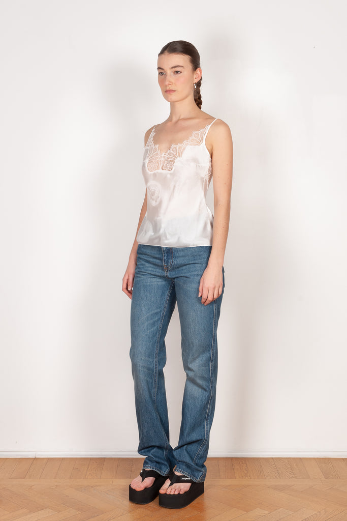 The Jacquard Cymatic Top by Coperni is a lingerie inspired silk top with a delicate scalloped lace neckline
