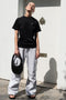 The Logo Boxy T-Shirt by Coperni is a signature relaxed Tee with a small slanted Coperni Logo on the front