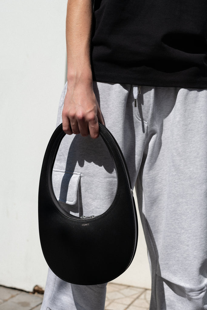 The Logo Boxy T-Shirt by Coperni is a signature relaxed Tee with a small slanted Coperni Logo on the front