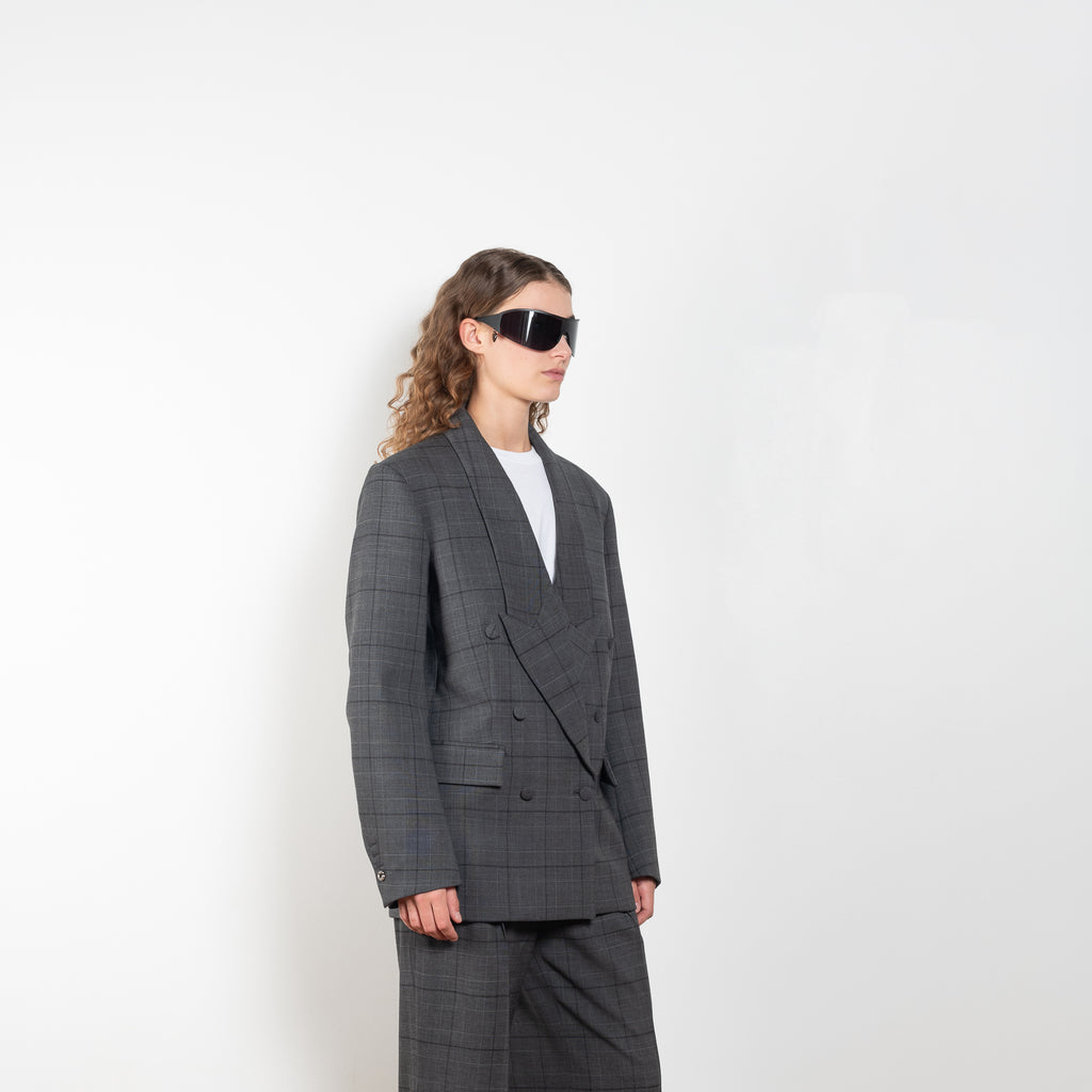 The Tailored Jacket by Coperni is a double breasted jacket with a relaxed fit in a seasonal windowpane check
