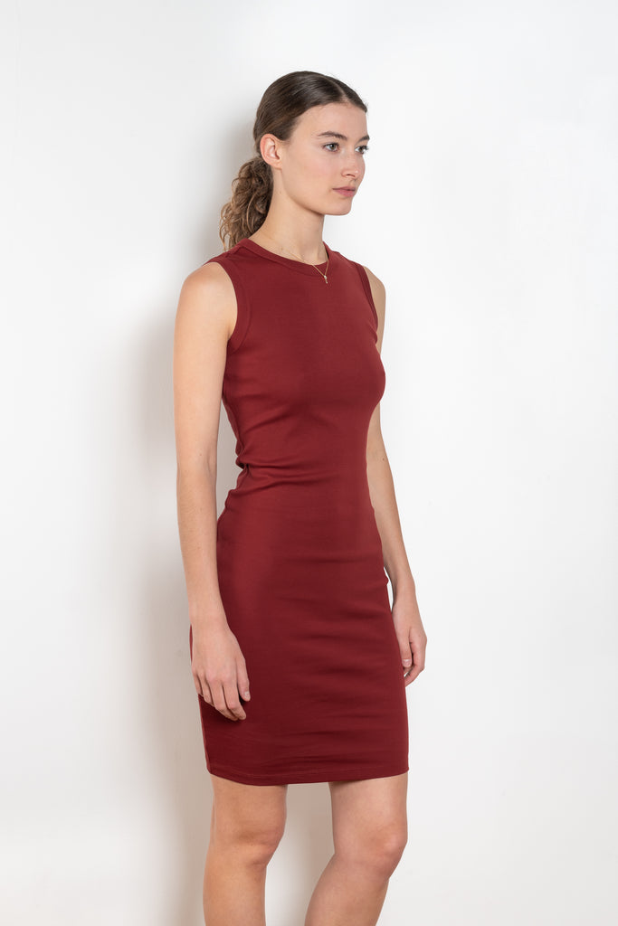 The Esme Dress by Flore Flore is a fitted crew neck tank dress with a double stitched cut-off seam on the back.