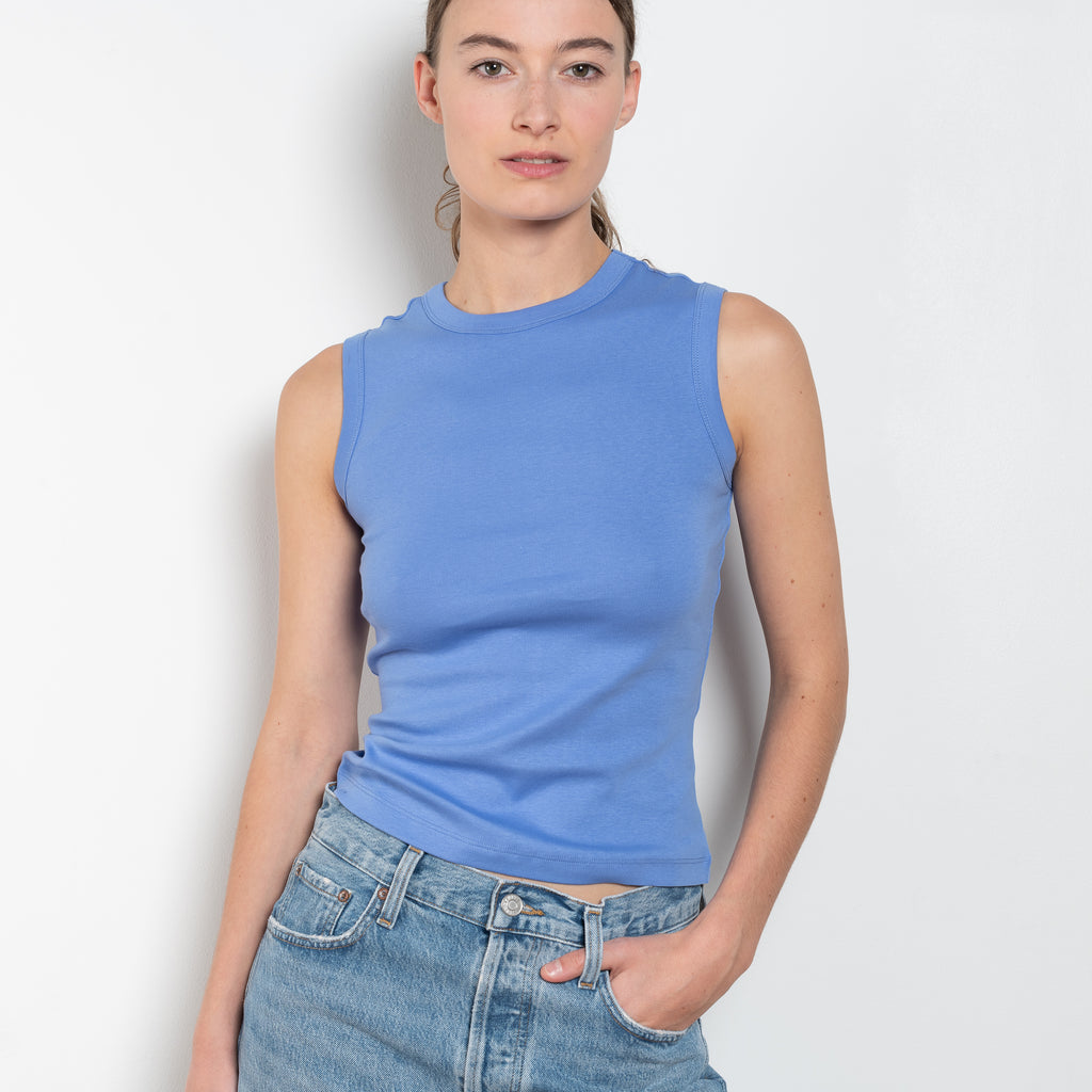 The Esme Tank by Flore Flore is a fitted crew neck tank top with a double stitched cut-off seam on the back.