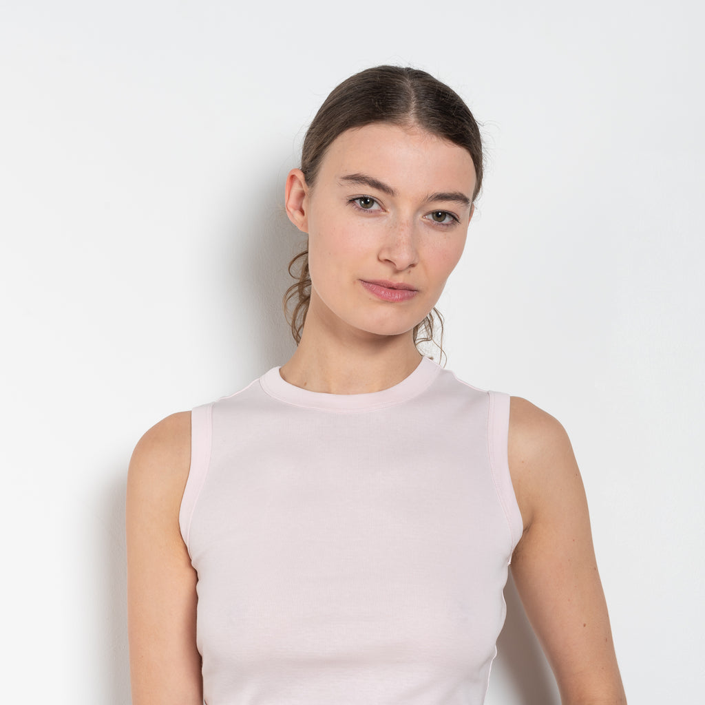 The Esme Tank by Flore Flore is a fitted crew neck tank top with a double stitched cut-off seam on the back.