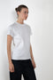 The Monica Tee by Flore Flore is a&nbsp;relaxed fit short-sleeved tee with a double stitched cut off seam on the back.