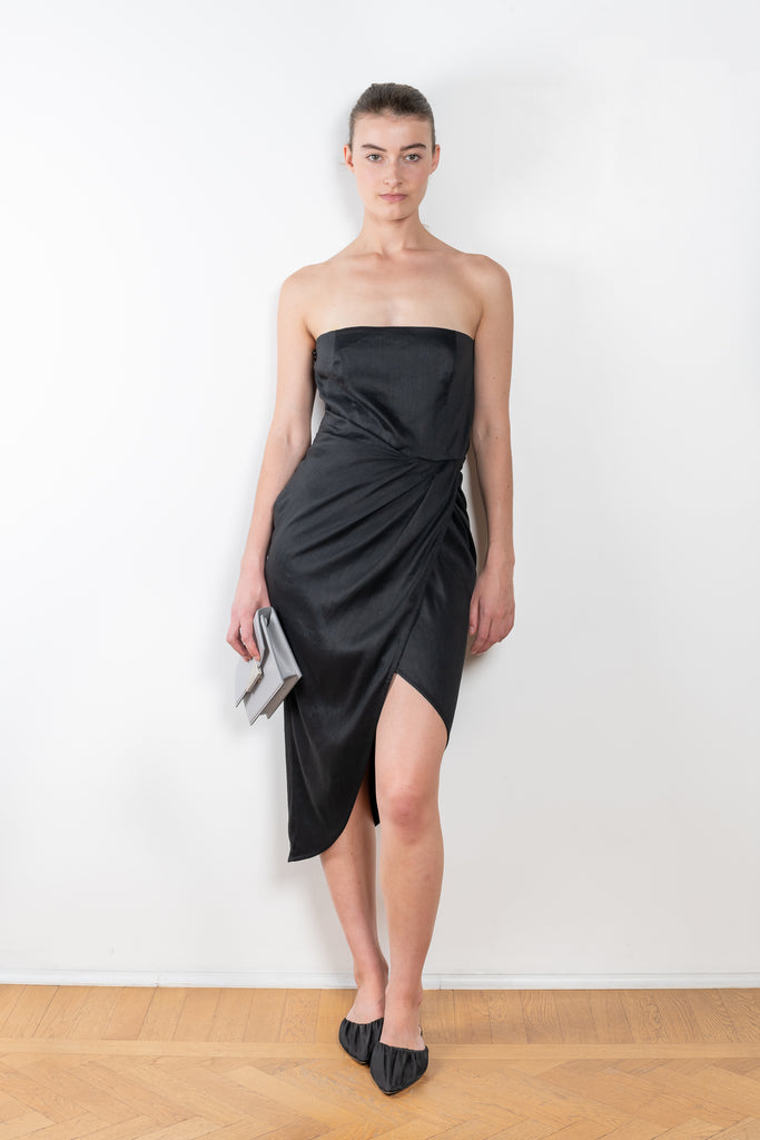 The Lica Midi Linen Dress by GAUGE81 is a linen bustier dress with a midi length wrap skirt detail