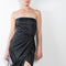 The Lica Midi Linen Dress by GAUGE81 is a linen bustier dress with a midi length wrap skirt detail