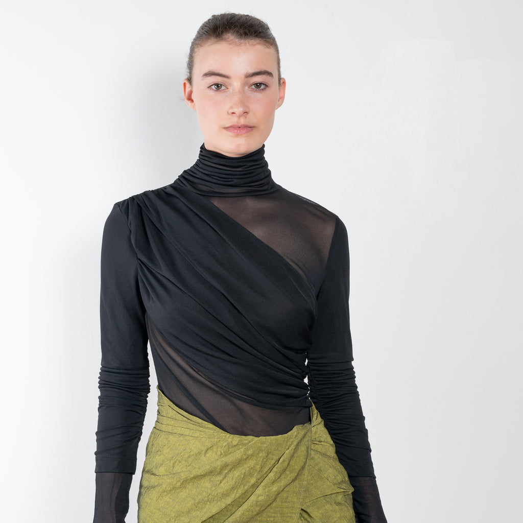 The Paita Midi Weave Skirt is a midi length wrap skirt with a zip closure in a linen blend