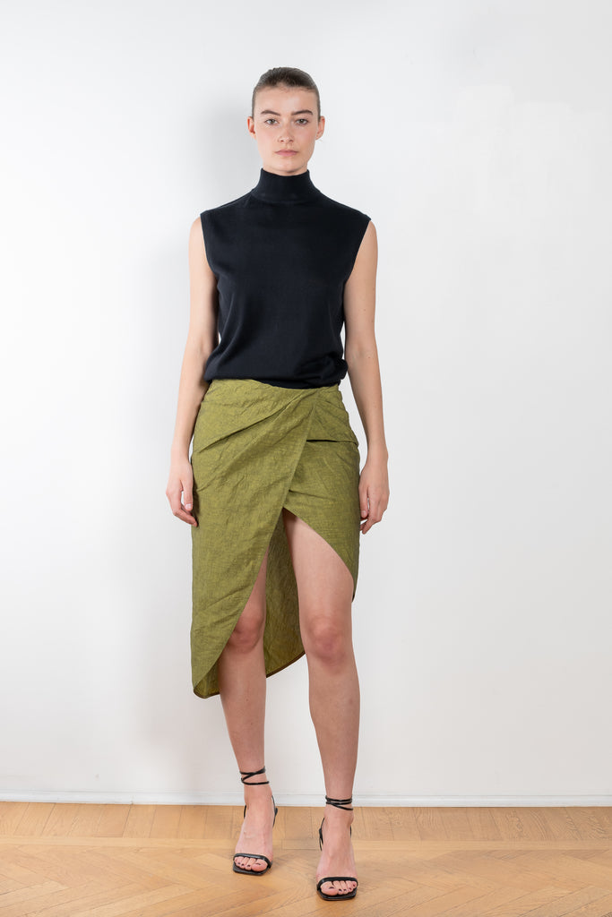 The Paita Midi Weave Skirt is a midi length wrap skirt with a zip closure in a linen blend