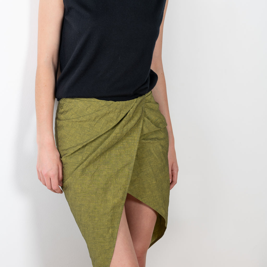 The Paita Midi Weave Skirt is a midi length wrap skirt with a zip closure in a linen blend