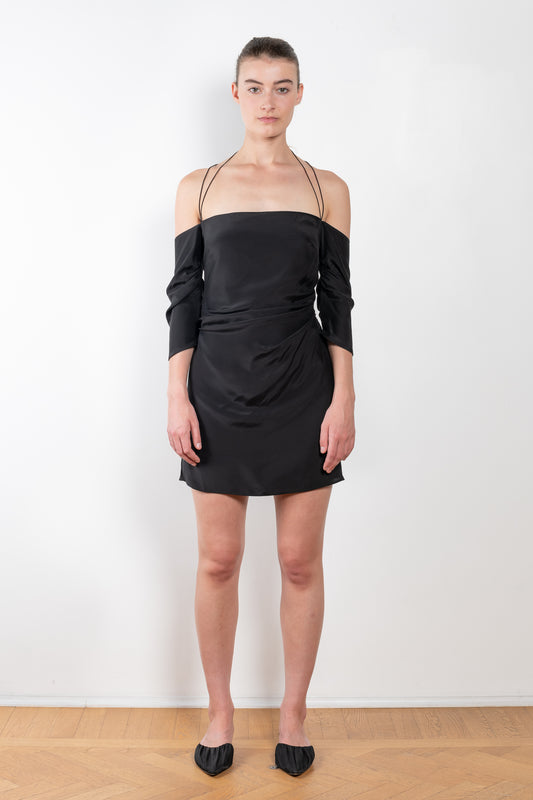 The Samaca Mini Dress by GAUGE81 is a silk off-the-shoulder dress with fine straps both as a halter & crossed back