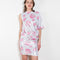 The Didi Slick Dress by Julie Kegels is a one sleeve Glossy dress in a tropical floral print with adjustable length