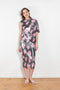 The Didi Slick Dress by Julie Kegels is Glossy dress with tropical flower print with adjustable length
