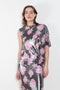 The Didi Slick Dress by Julie Kegels is Glossy dress with tropical flower print with adjustable length