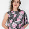 The Didi Slick Dress by Julie Kegels is Glossy dress with tropical flower print with adjustable length