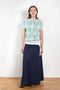 The Jamaica Polo Skirt by Julie Kegels is a maxi skirt in piqué cotton with contrasting waistband