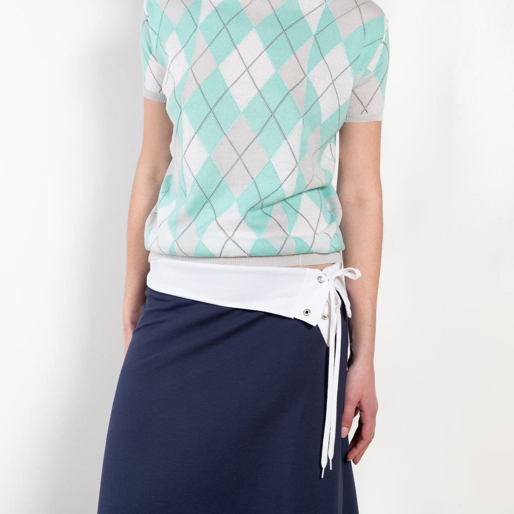 The Jamaica Polo Skirt by Julie Kegels is a maxi skirt in piqué cotton with contrasting waistband
