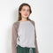 The Joan Bodysuit by Julie Kegels is a 2-tone raglan longsleeve bodysuit with sunbleached seams