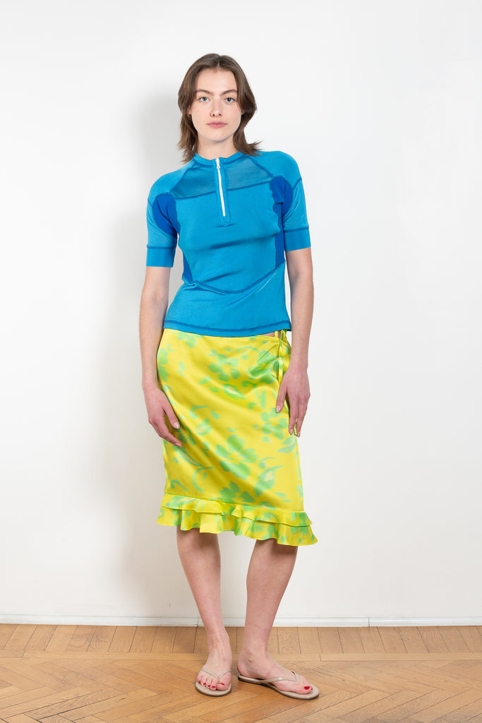 The Sonny Silk Skirt by Julie Kegels is a low waist silk skirt with a cut-out belt loop detail and a floral print