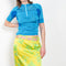 The Sonny Silk Skirt by Julie Kegels is a low waist silk skirt with a cut-out belt loop detail and a floral print