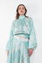 The Susan Circle Skirt by Julie Kegels is a silk midi skirt with contrasting waistband