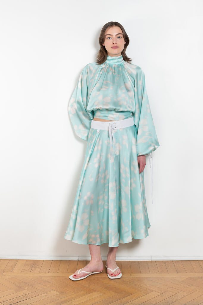 The Susan Circle Skirt by Julie Kegels is a silk midi skirt with contrasting waistband