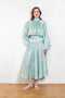 The Susan Circle Skirt by Julie Kegels is a silk midi skirt with contrasting waistband