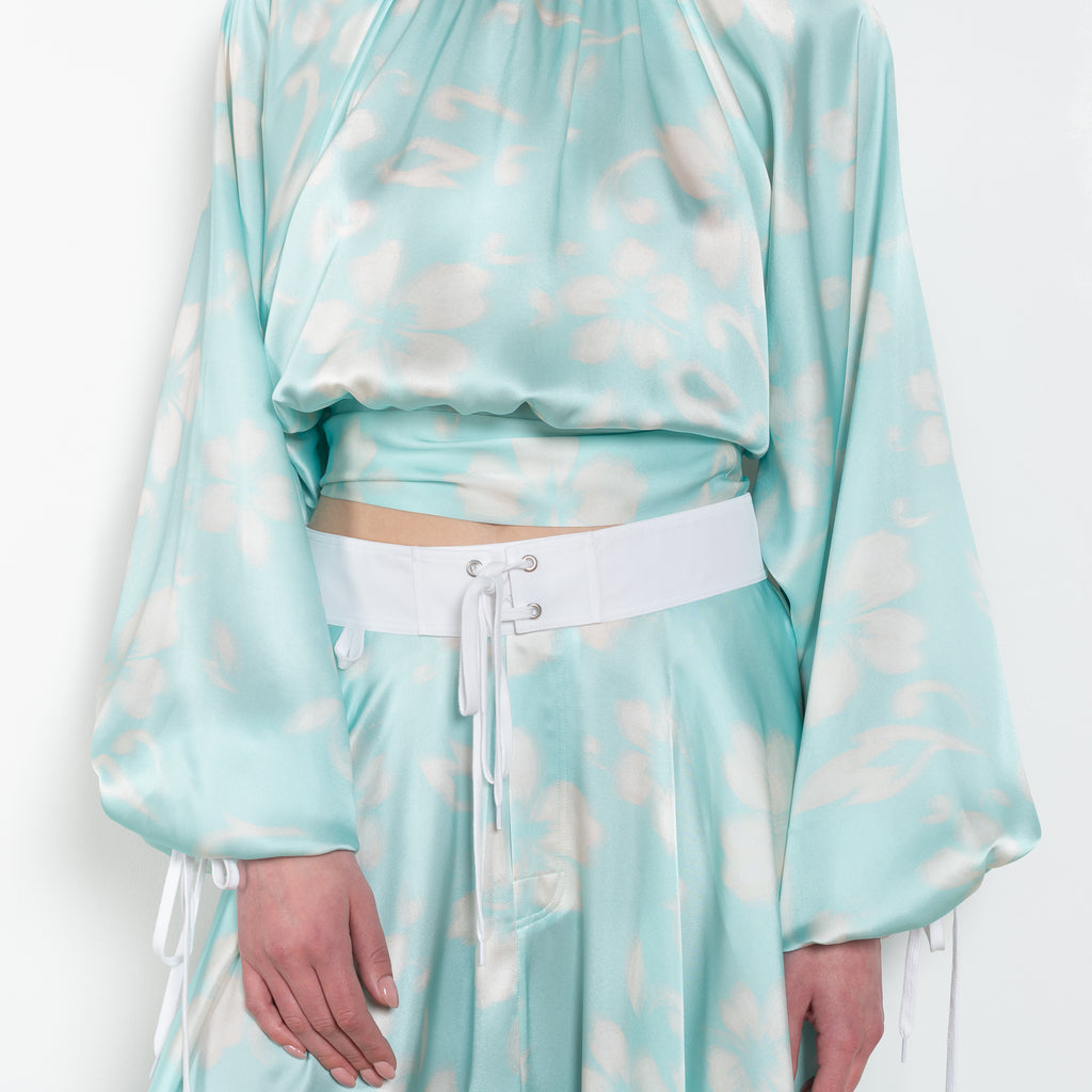 The Susan Circle Skirt by Julie Kegels is a silk midi skirt with contrasting waistband