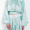 The Susan Circle Skirt by Julie Kegels is a silk midi skirt with contrasting waistband