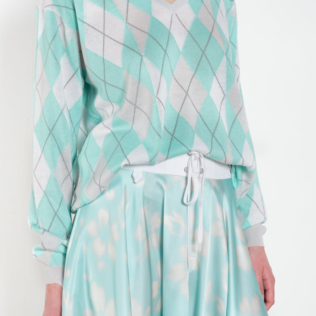 The Susan Circle Skirt by Julie Kegels is a silk midi skirt with contrasting waistband