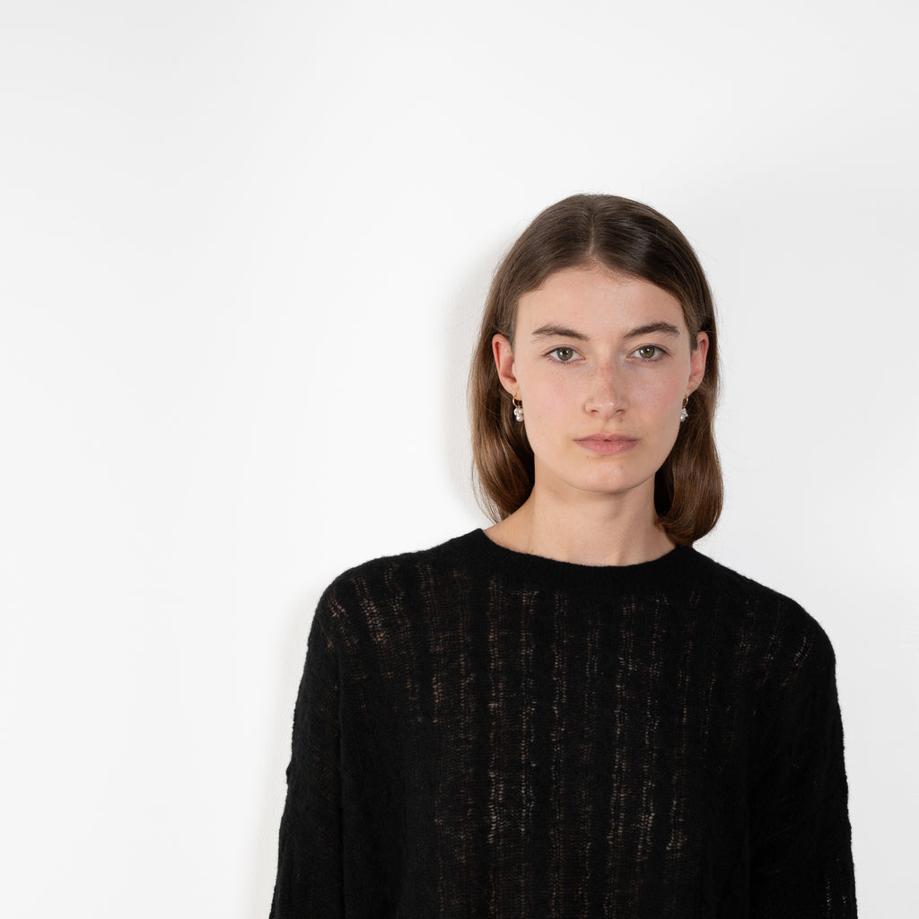 The Amabel Sweater by Lisa Yang is crafted in featherlight silk cashmere with a sheer, airy hand.
