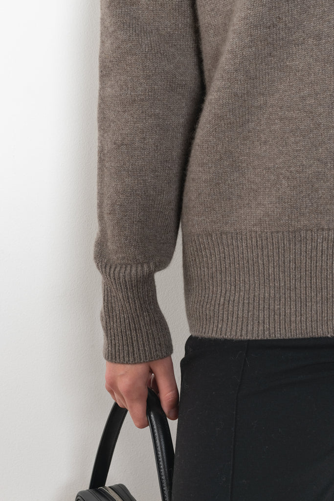 The Amery Cardigan by Lisa Yang is heavy knit cardigan with a longer fit, a deep V neck dropped shoulders and a accentuated rib detail at the hem