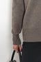 The Amery Cardigan by Lisa Yang is heavy knit cardigan with a longer fit, a deep V neck dropped shoulders and a accentuated rib detail at the hem