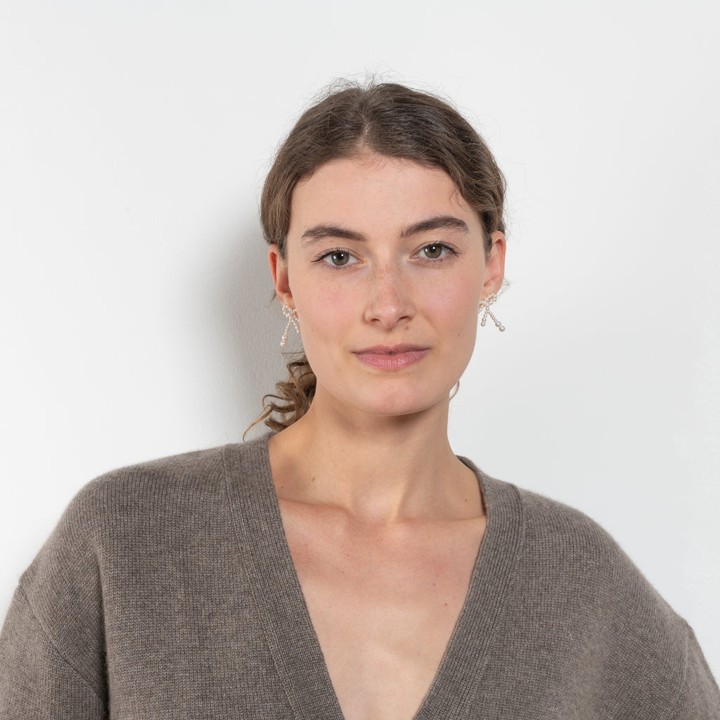 The Amery Cardigan by Lisa Yang is heavy knit cardigan with a longer fit, a deep V neck dropped shoulders and a accentuated rib detail at the hem