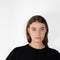 The Cila Tee by LISA YANG is a fine knit cashmere t-shirt with a classic round neck and rolled trim edges