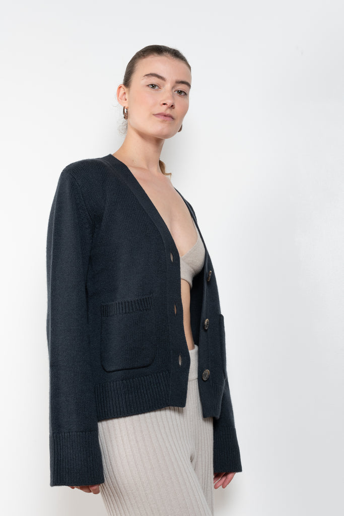 The Danni Cardigan by LISA YANG has extended sleeves for a feminine look, accentuated by patch pockets, ribbed trims and dropped shoulders