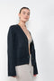 The Danni Cardigan by LISA YANG has extended sleeves for a feminine look, accentuated by patch pockets, ribbed trims and dropped shoulders
