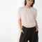 The Genevra Tshirt by LISA YANG is crafted in our warm weather standard 14-gauge cashmere. The regular fit, hip-length silhouette features a round neck, dropped shoulders