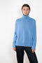 The Heidi Sweater by Lisa Yang&nbsp;is crafted in rich, heavy knit cashmere. The cocooning silhouette is made more inviting by an enveloping high neck, dropped shoulders, full-length sleeves