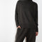 The Heidi Sweater by Lisa Yang is crafted in rich, heavy knit cashmere