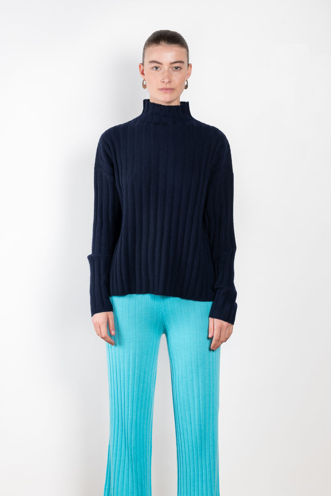 The Inga Sweater by Lisa Yang is a fine cashmere knit with a wide rib and high neck