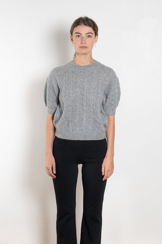 The Kenzie Sweater Sweater by Lisa Yang is a softly voluminous cable knit top in a delicate silk cashmere blend.