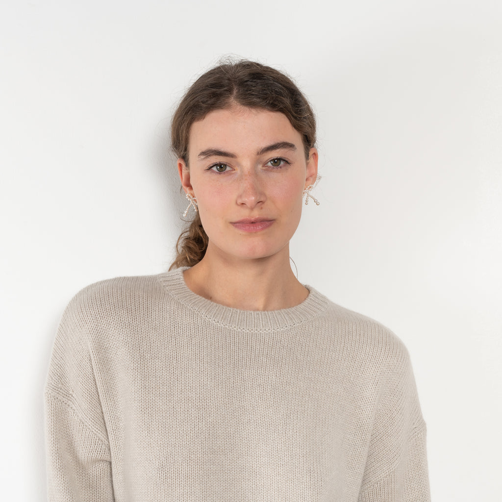 The Kristy Sweater by Lisa Yang is a 5 gauge cashmere relaxed knit with a longline silhouette and crewneck crafted in a heavy knit cashmere with a textured hand feel