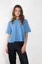 The Liru Tshirt by LISA YANG is knitted in 12-gauge cashmere. The relaxed fit falls from a ribbed round neck into a wide A-line, peplum-inspired shape
