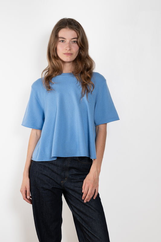 The Liru Tshirt by LISA YANG is knitted in 12-gauge cashmere. The relaxed fit falls from a ribbed round neck into a wide A-line, peplum-inspired shape
