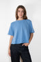 The Liru Tshirt by LISA YANG is knitted in 12-gauge cashmere. The relaxed fit falls from a ribbed round neck into a wide A-line, peplum-inspired shape