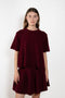 The Liru Tshirt by LISA YANG is knitted in 12-gauge cashmere. The relaxed fit falls from a ribbed round neck into a wide A-line, peplum-inspired shape, complete with dropped shoulders, short sleeves and rolled hems