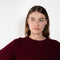 The Liru Tshirt by LISA YANG is knitted in 12-gauge cashmere. The relaxed fit falls from a ribbed round neck into a wide A-line, peplum-inspired shape, complete with dropped shoulders, short sleeves and rolled hems